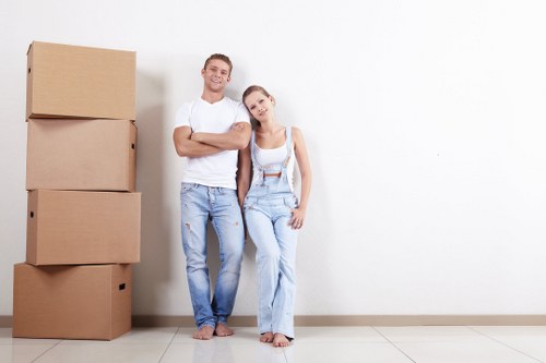 Furniture removals team handling large household items in Bromley