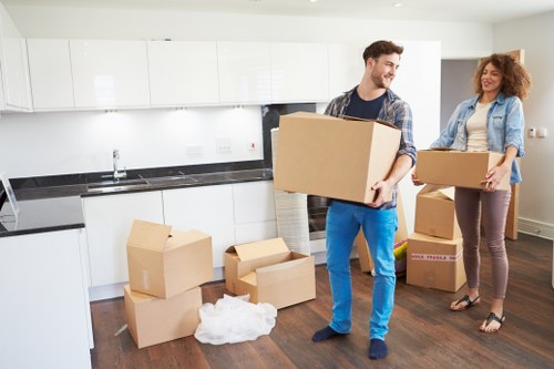 Packed office boxes and furniture ready for local transport