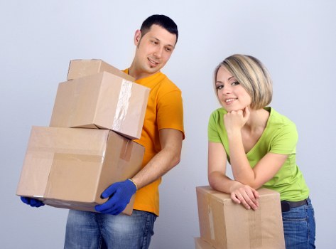 Professional movers handling desks and equipment in Bromley
